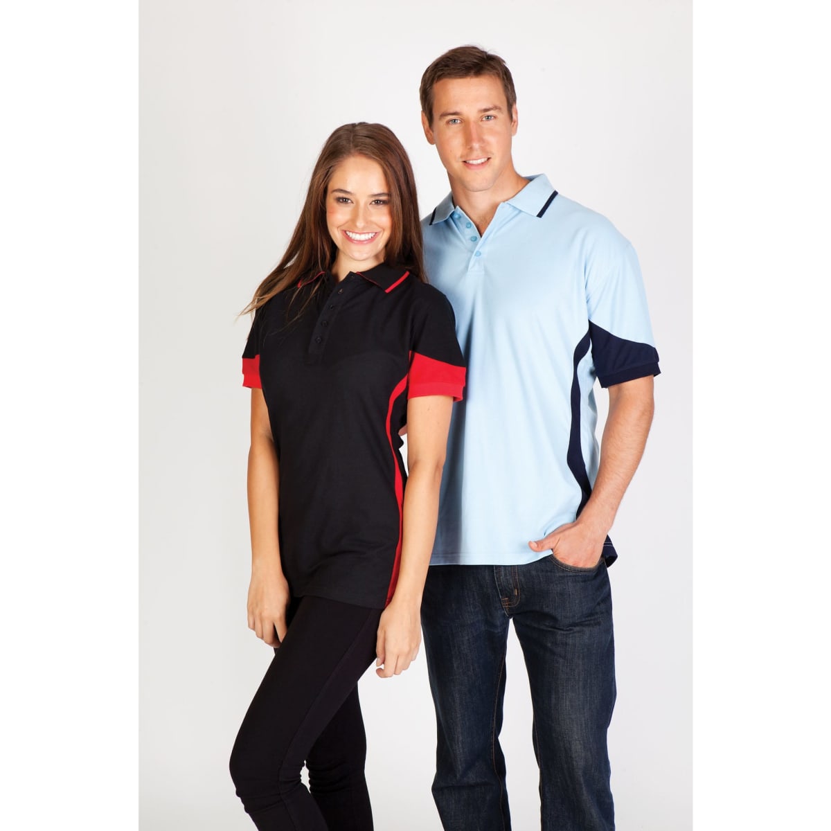 A black and red women's polo shirt and a light blue men's polo shirt, both featuring contrasting panels and logos.