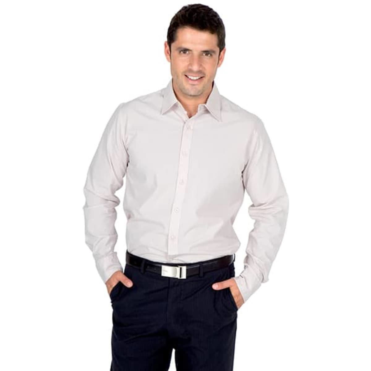 A light pink long sleeve button-up shirt worn by a smiling man with dark hair, standing with hands in pockets.