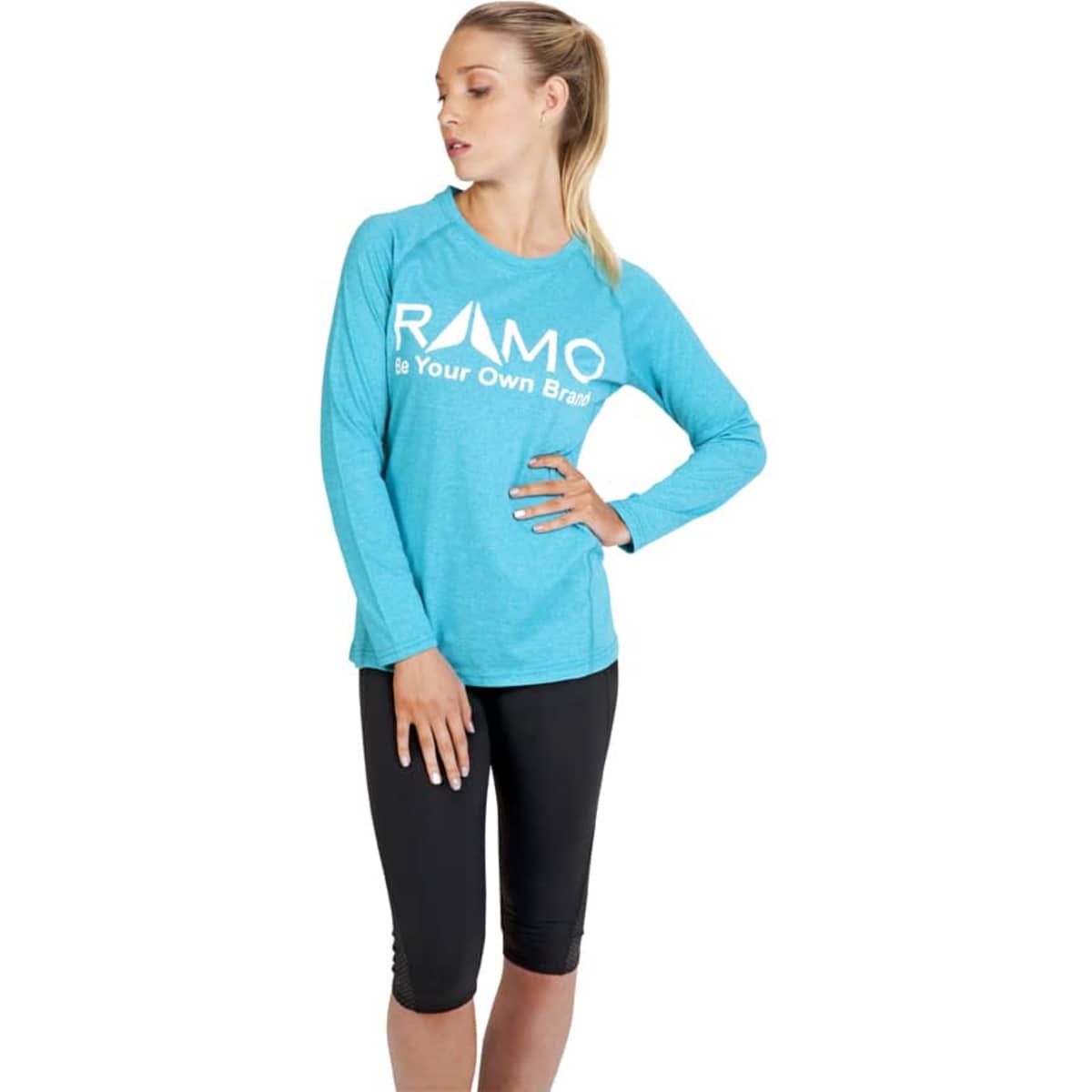 A long sleeve t-shirt in heather turquoise featuring a logo, paired with black leggings.