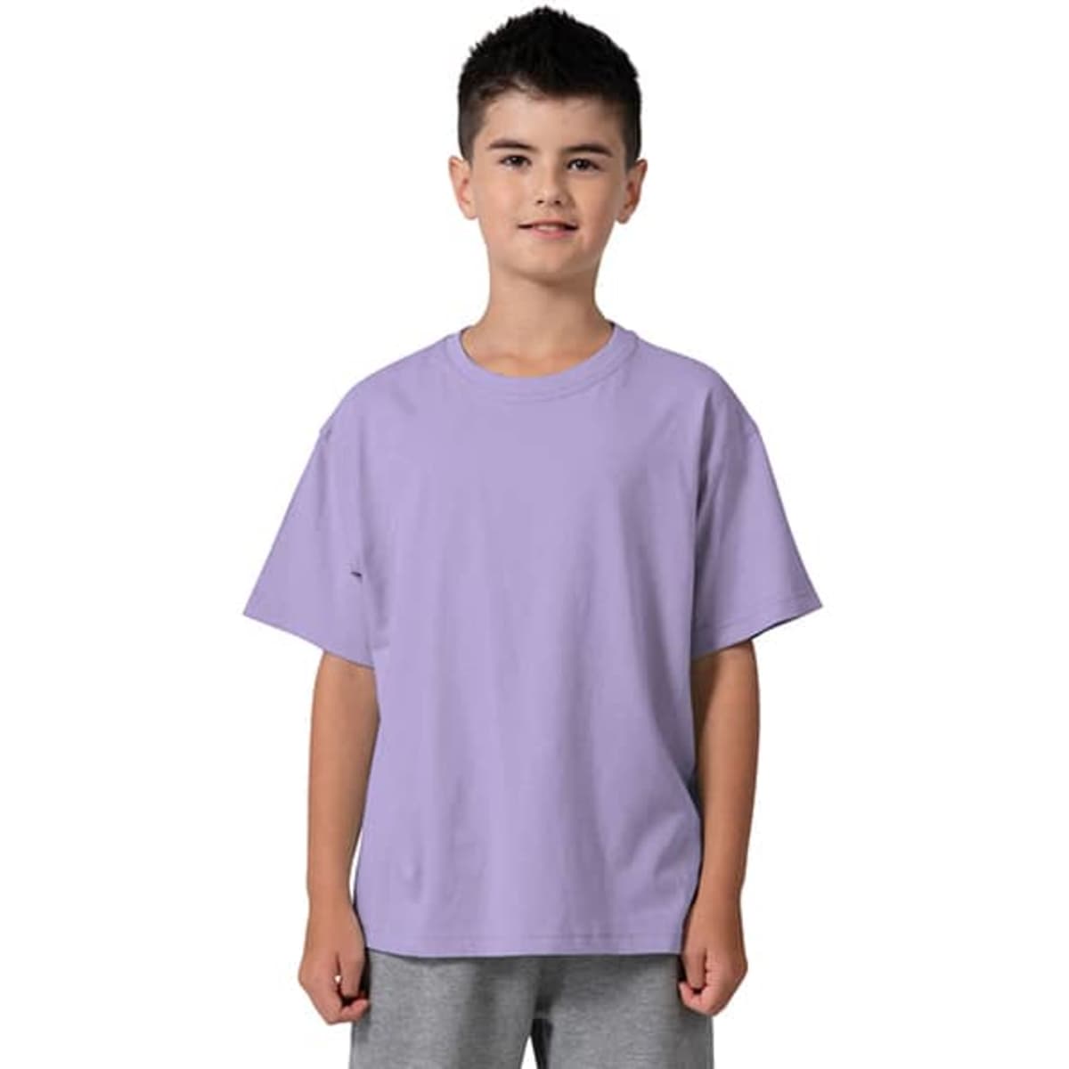 A kid's regular T-shirt in light purple, featuring short sleeves and a relaxed fit. The model is smiling and standing.