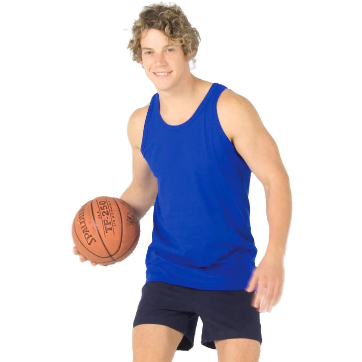 A young man in a blue cotton singlet and shorts holds a basketball on an outdoor court with a hoop in the background.