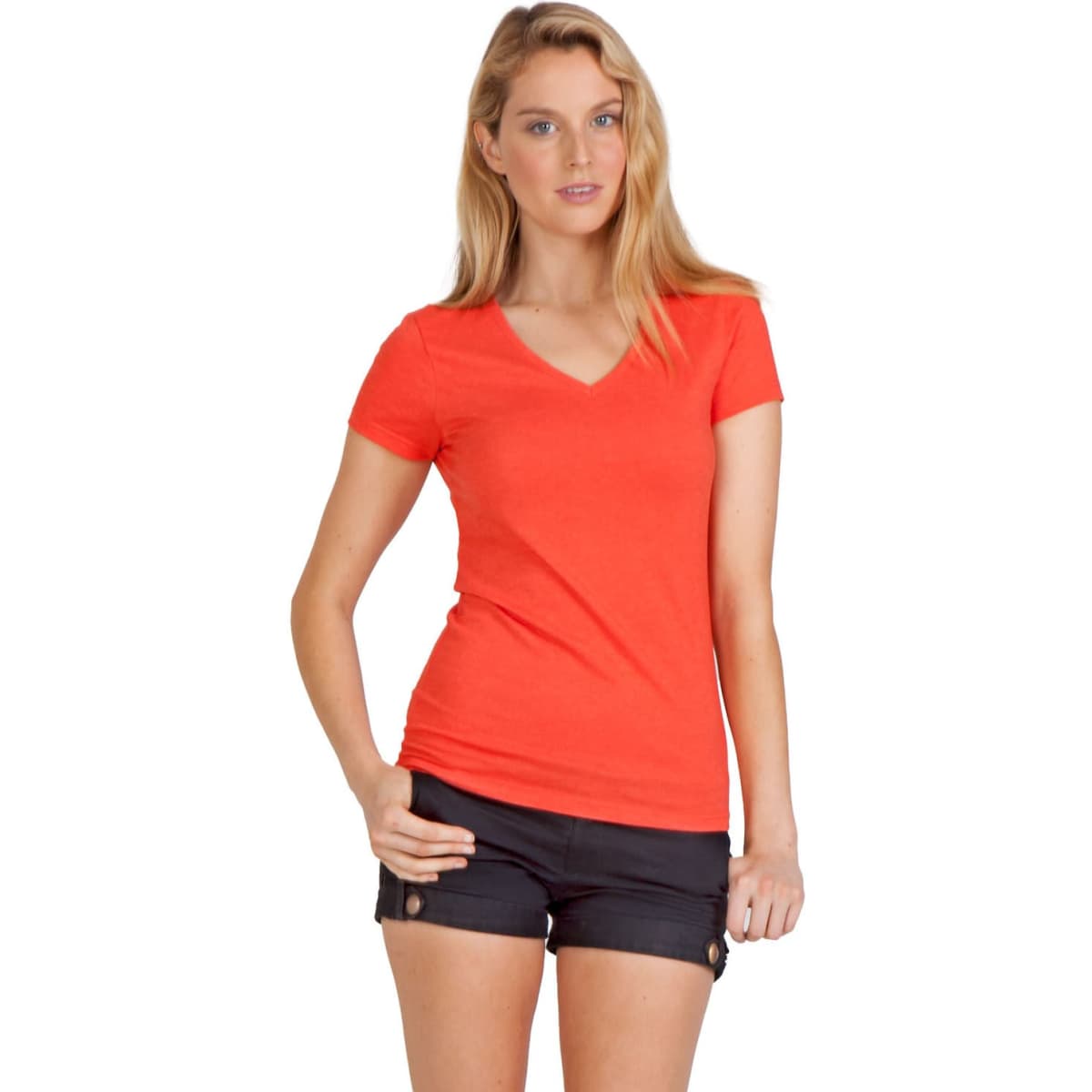 A woman wearing an orange marl V-neck T-shirt paired with black shorts and sandals, posing against a plain background.