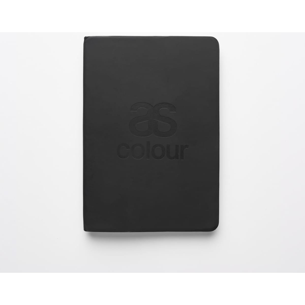 A black notebook featuring a logo on the front cover, with a smooth, matte finish.