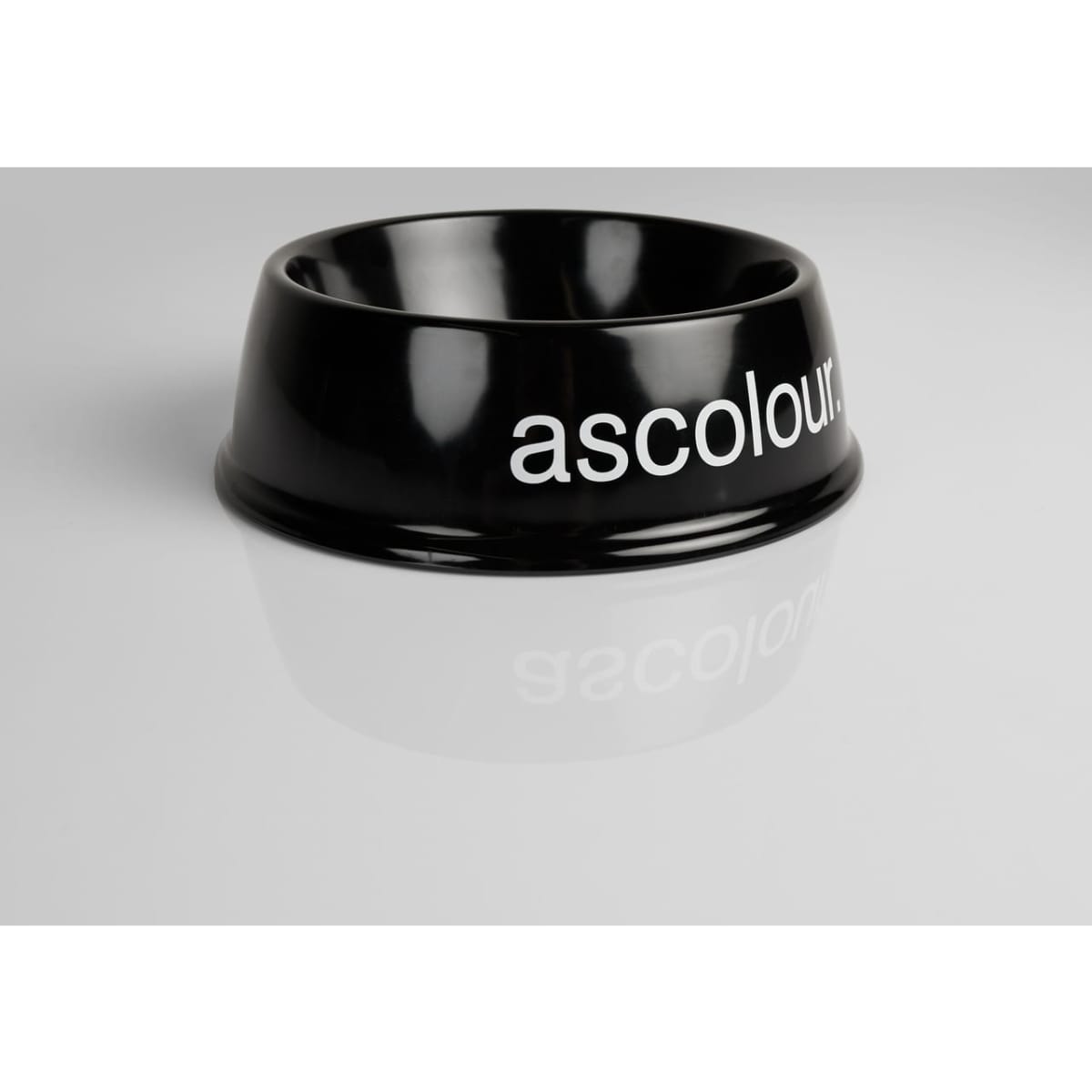 A black pet bowl with a glossy finish and a branding logo. Ideal for pet accessories.