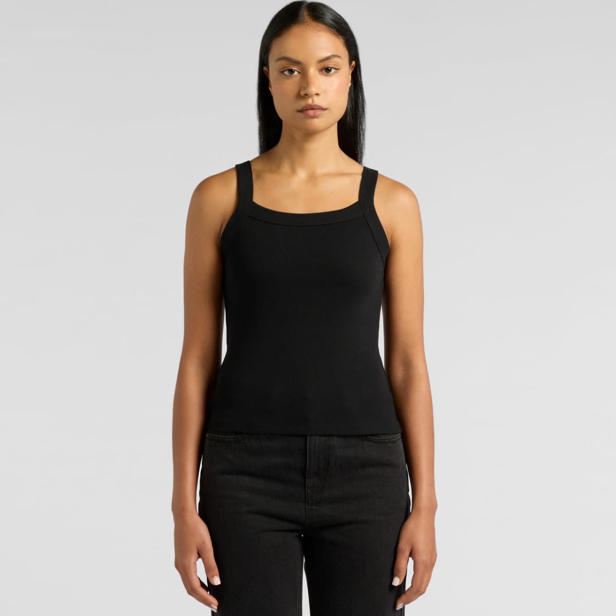 A black collegiate tank top with a square neckline and a fitted design. The model stands against a plain background.