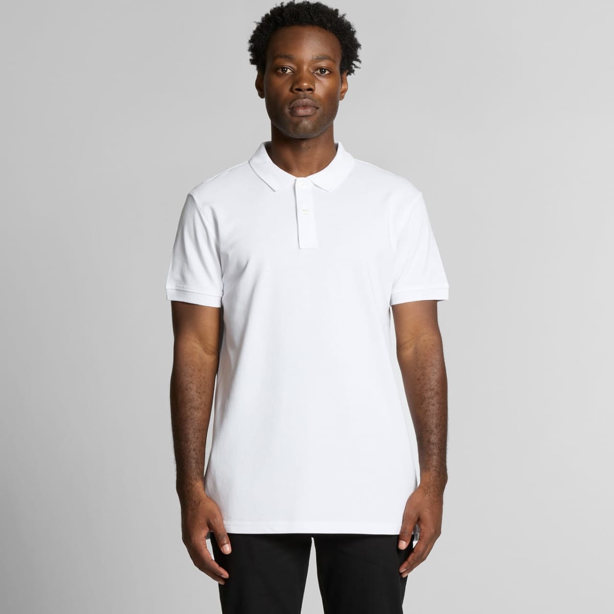 A white polo shirt with a collar and a logo, featuring a straight cut design.