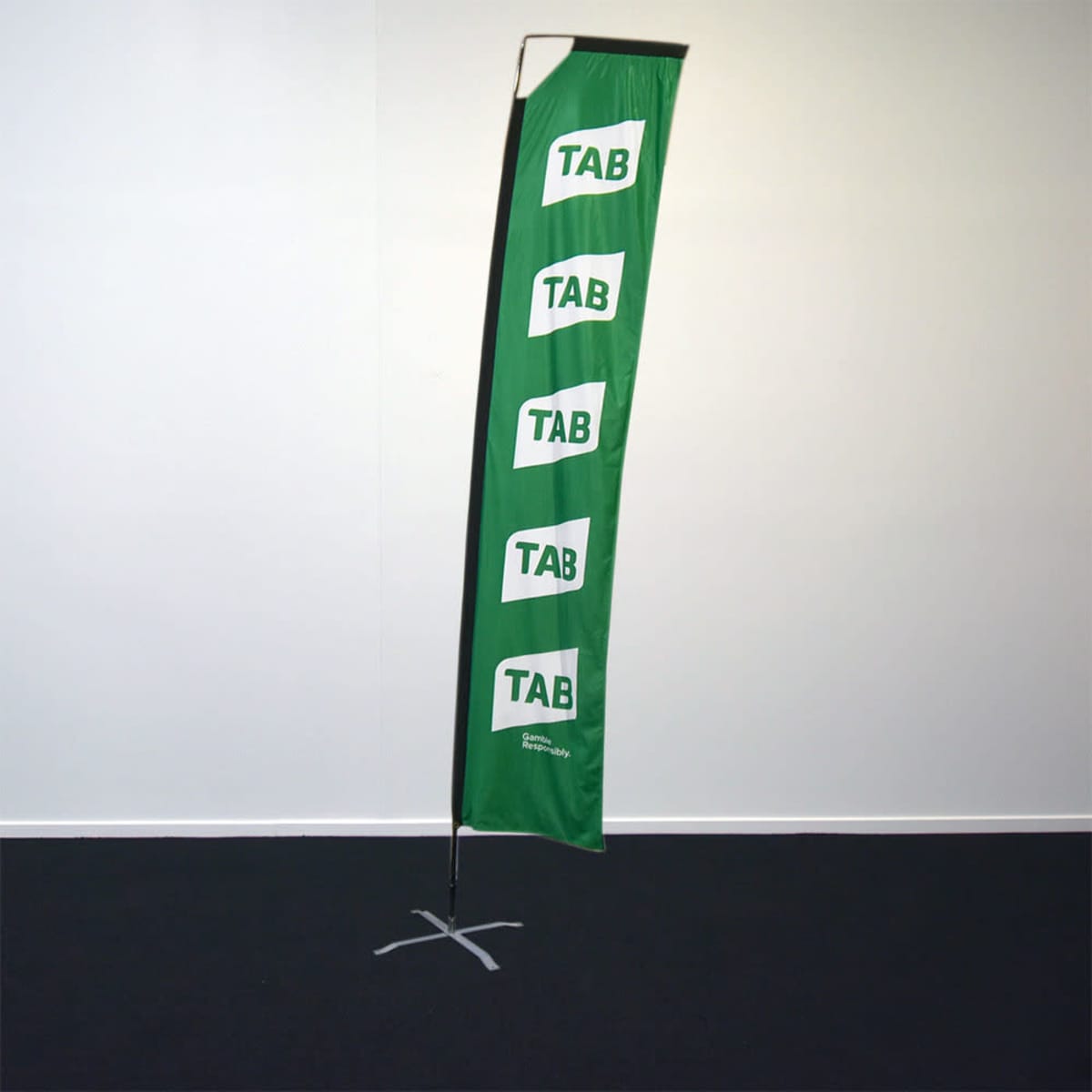 A green rectangular banner set with multiple tabs displayed, featuring a logo and standing on a base.