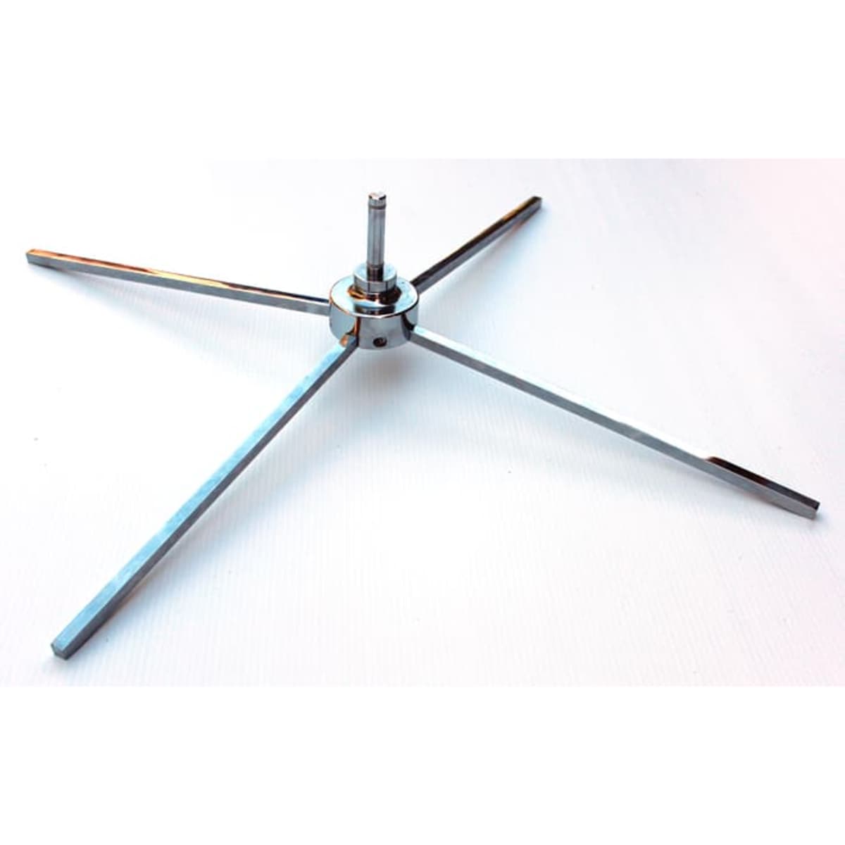 A metallic retractable cross base with four elongated arms, designed for stability and support.