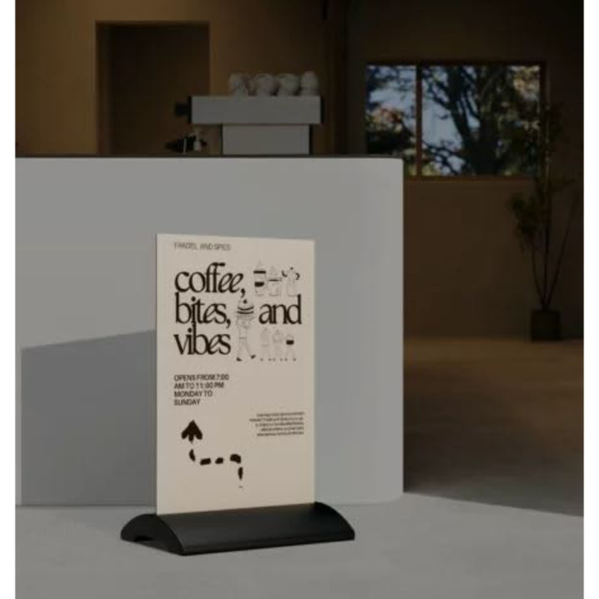 A black signage stand with a Dibond panel featuring promotional text, placed next to a light-coloured countertop.