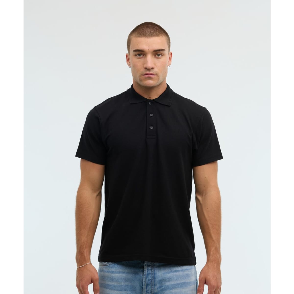 A black polo shirt with a collared neckline and button placket, featuring short sleeves and a fitted design.