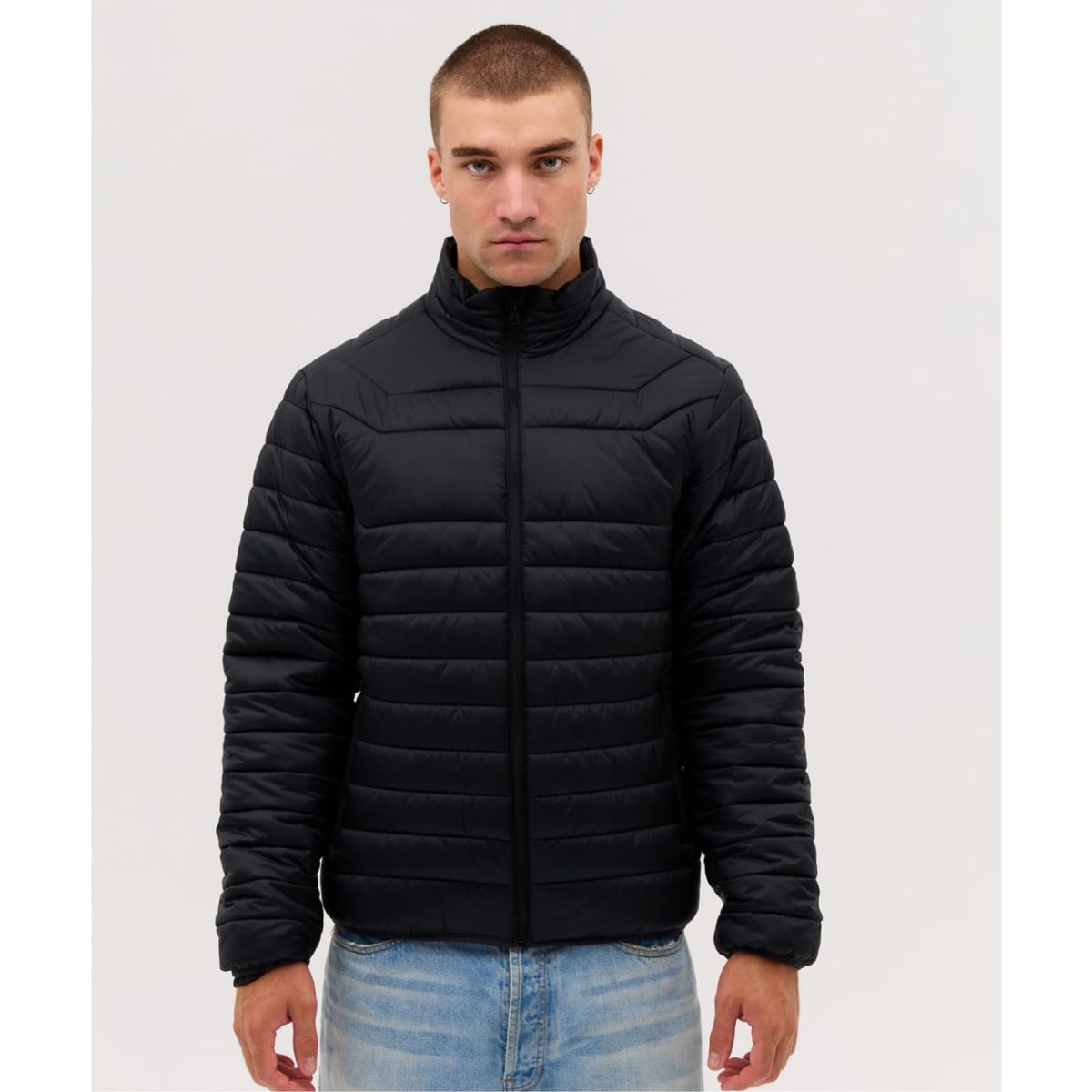 A black puffer jacket featuring a zip front and a high collar, displayed against a neutral background.
