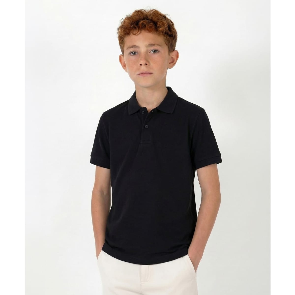 A black polo shirt designed for youth, featuring a classic collar and a logo on the chest.