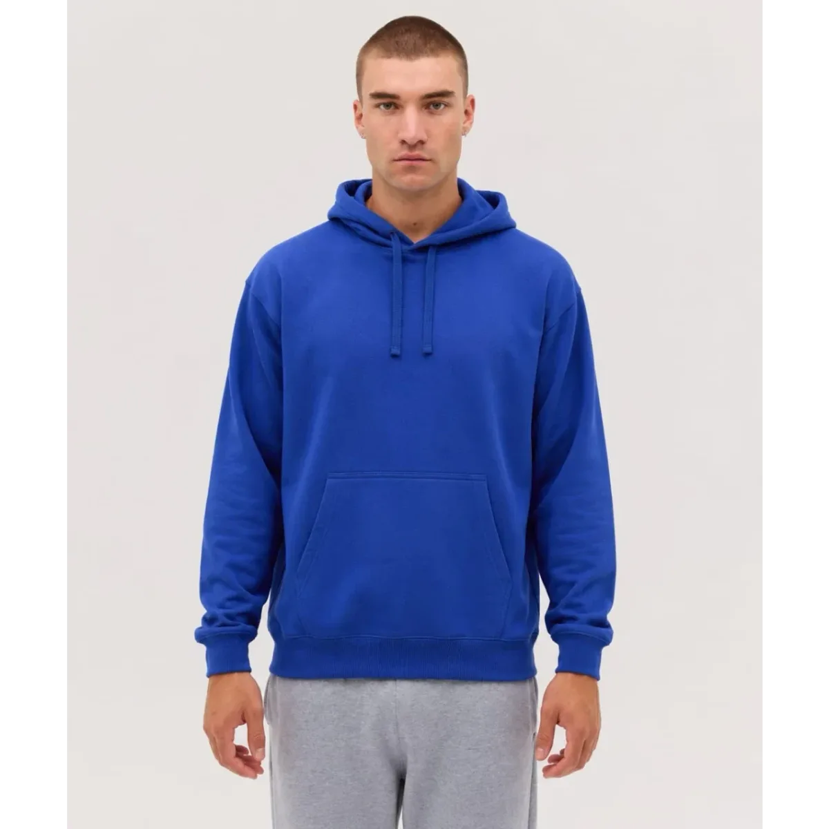A blue hoodie with a front pocket and drawstring hood, featuring a logo on the chest.
