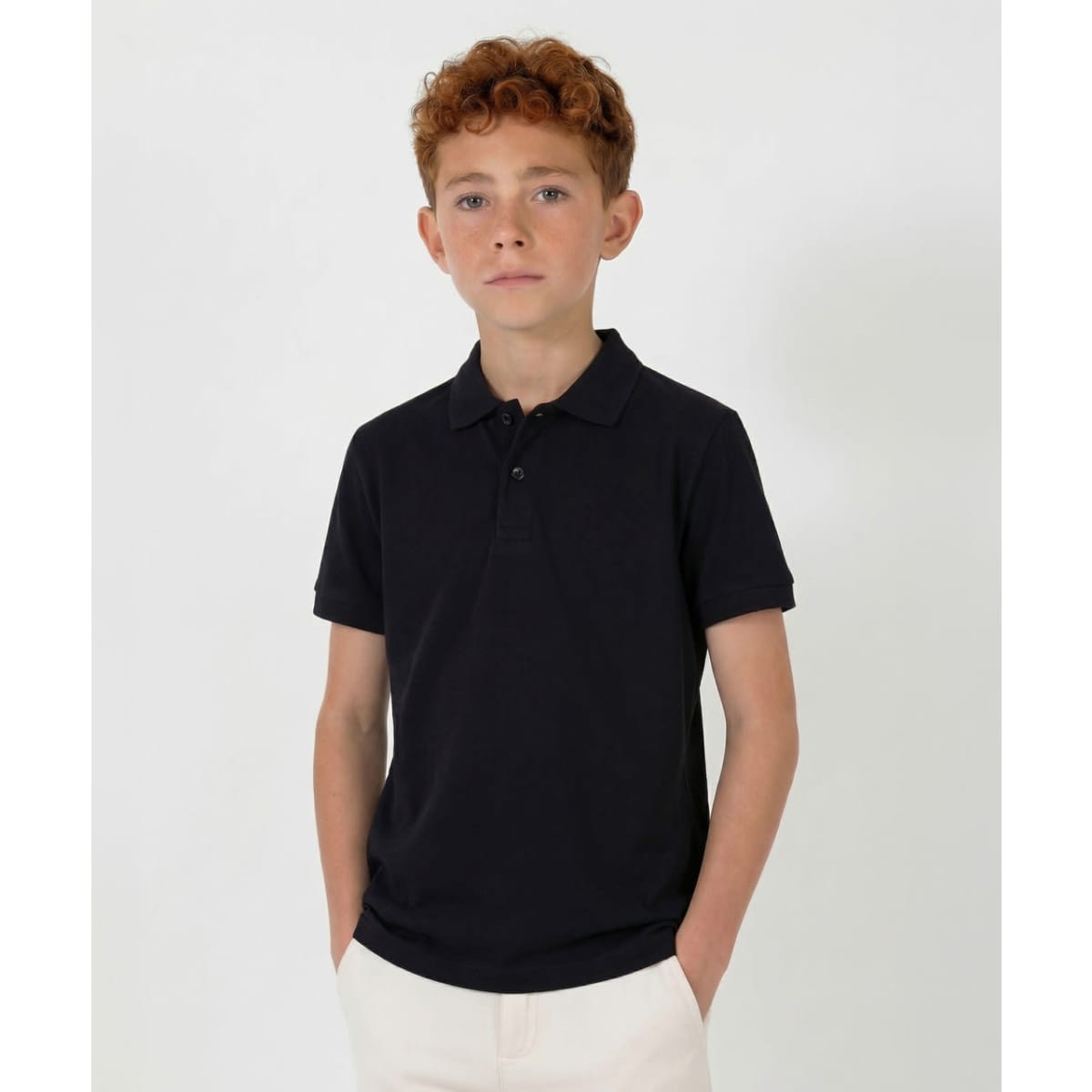 A youth black polo shirt with a collar and short sleeves, featuring a logo on the chest.