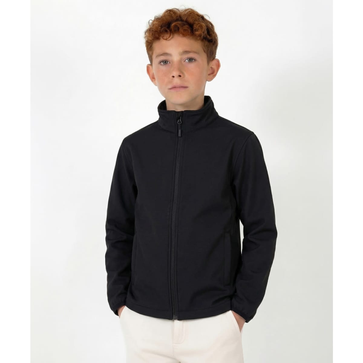 A black softshell jacket for youth with a zip front and a high collar, featuring a logo on the chest.