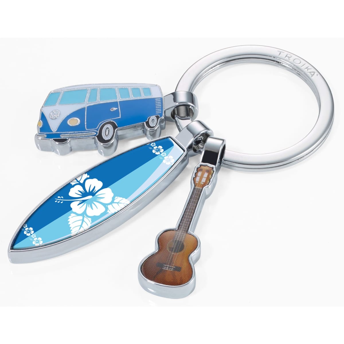 A keyring featuring a blue surfboard, a blue van, and a guitar charm, all on a silver ring.