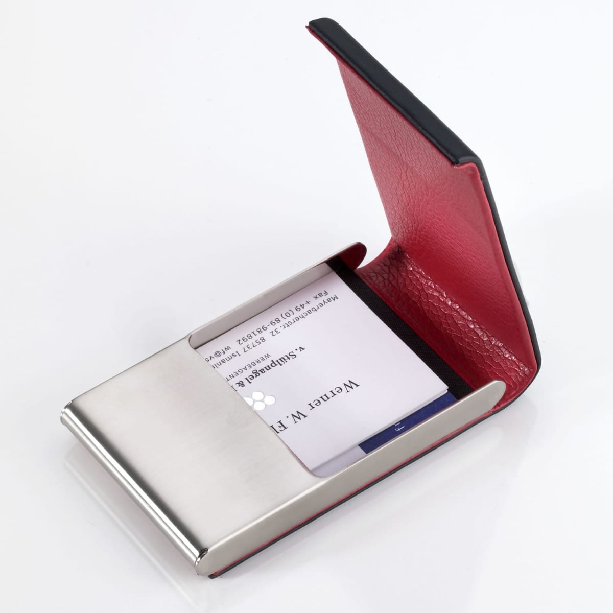 A red and silver business card holder with a sleek design, featuring a stainless steel base and a textured red cover.