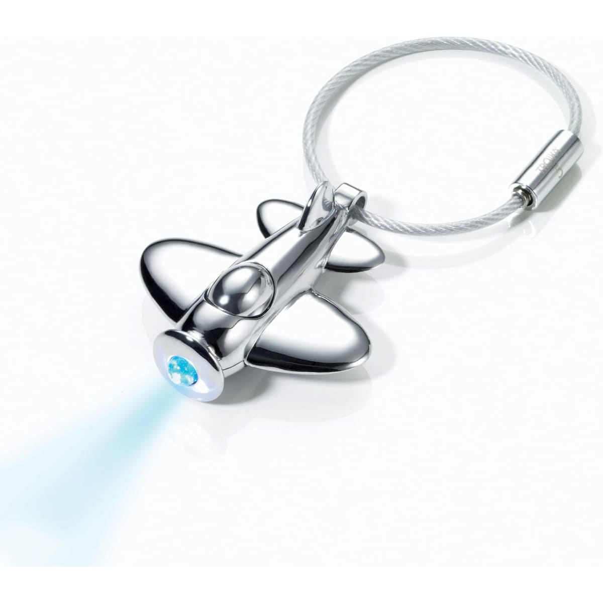 A silver aircraft-shaped keychain with a blue light and a metal loop for attachment.