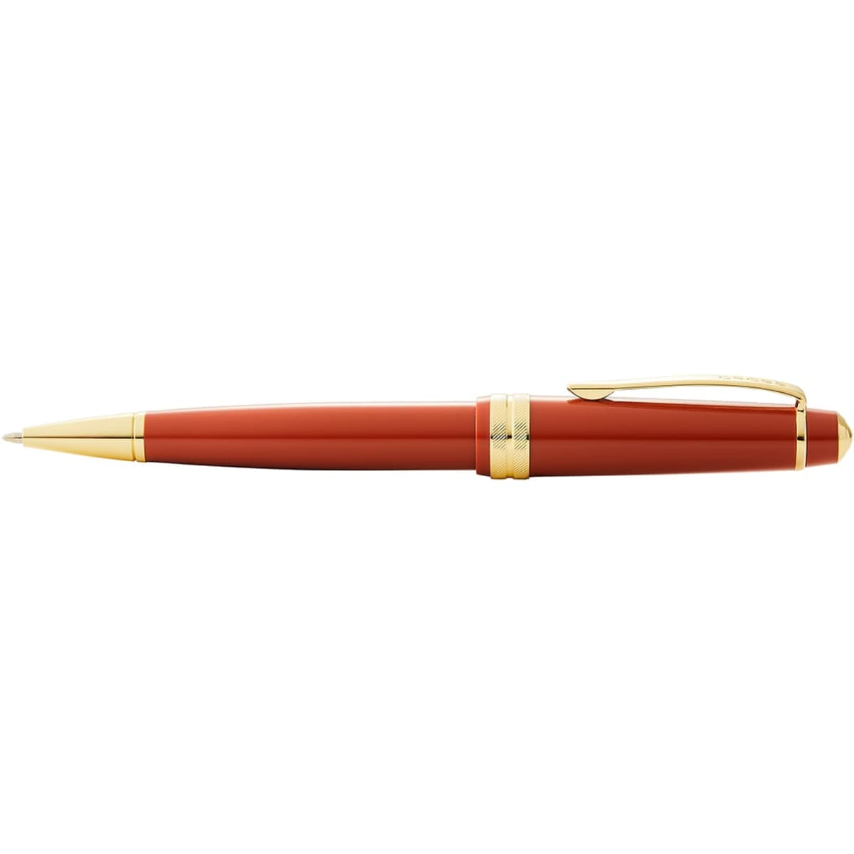 A pen in burnt orange with gold detailing, featuring a polished resin finish and a clip.
