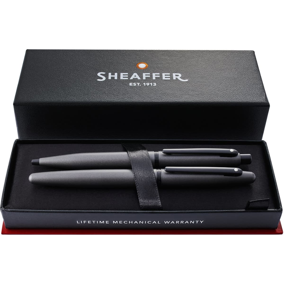 A gift box containing a gunmetal grey ballpoint pen and rollerball pen, with a black interior and outer branding.