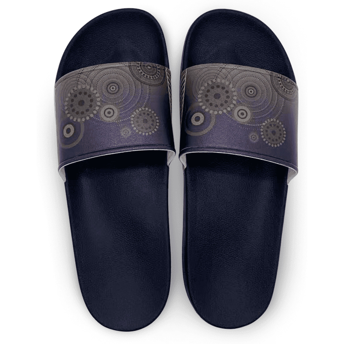 Navy slippers featuring a patterned strap with circular designs in shades of purple and gold.
