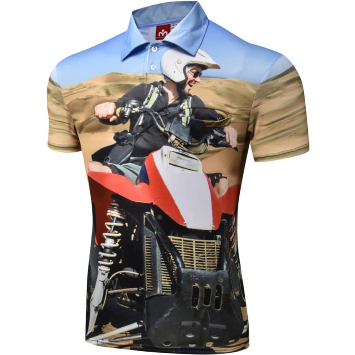 A short-sleeved polo shirt featuring a vibrant design of a man riding an ATV in a sandy landscape. It has a logo.