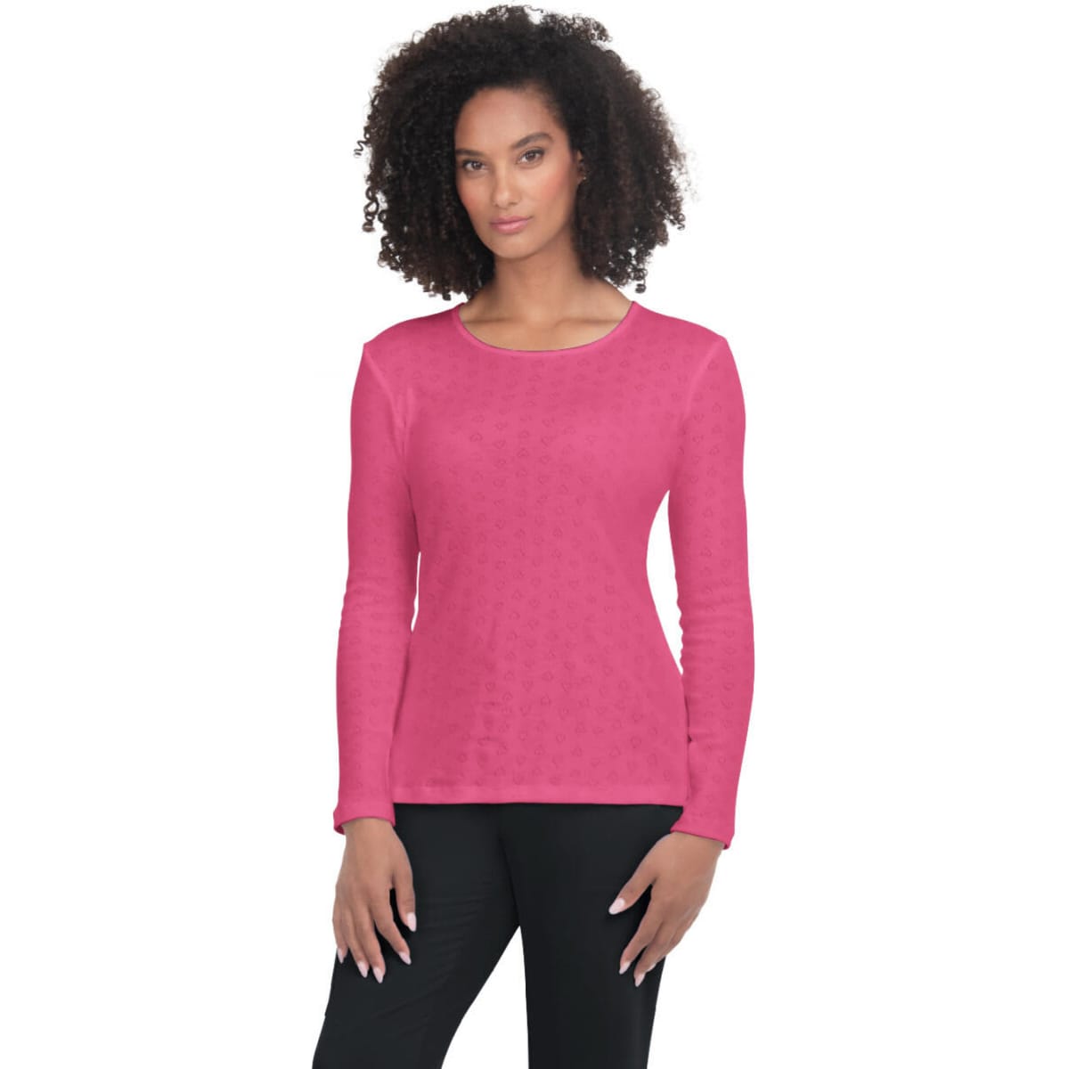 A pink long-sleeve top on a model, featuring a round neckline and a textured pattern. It has a logo on it.