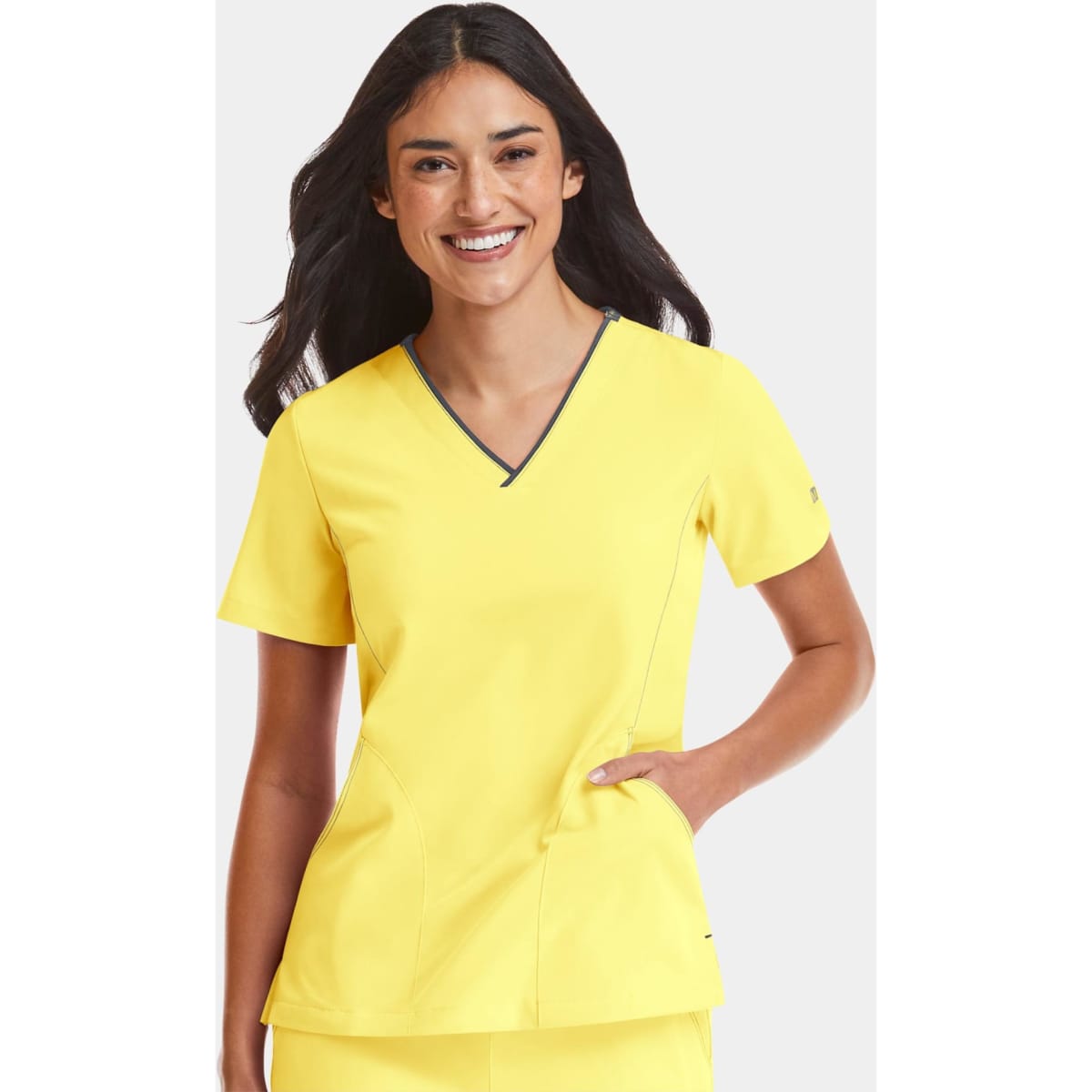 A women’s v-neck top in vibrant yellow with contrast detailing and a subtle logo.