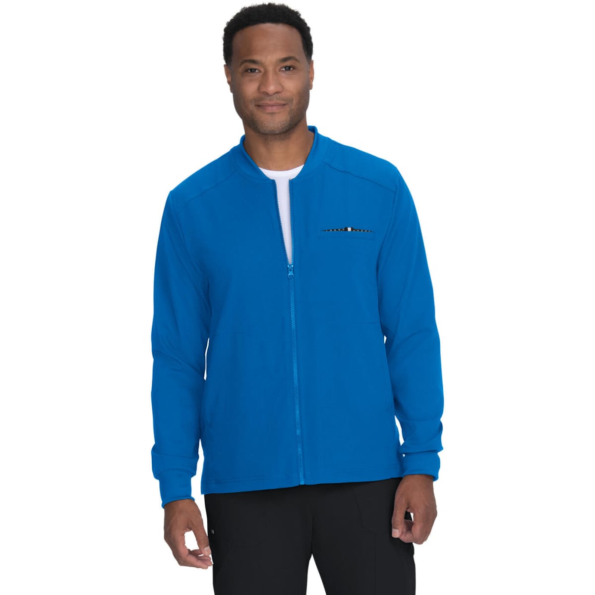 A blue jacket with a zip and a logo, worn by a man standing against a plain background.