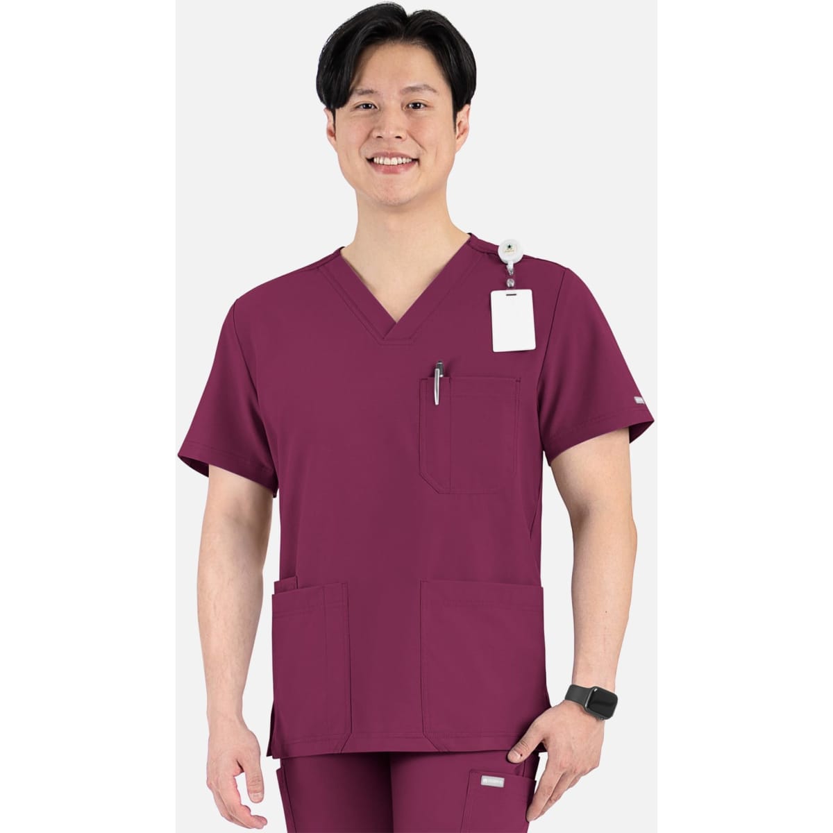 A men's v-neck top in maroon featuring four pockets and a logo, worn by a smiling model.