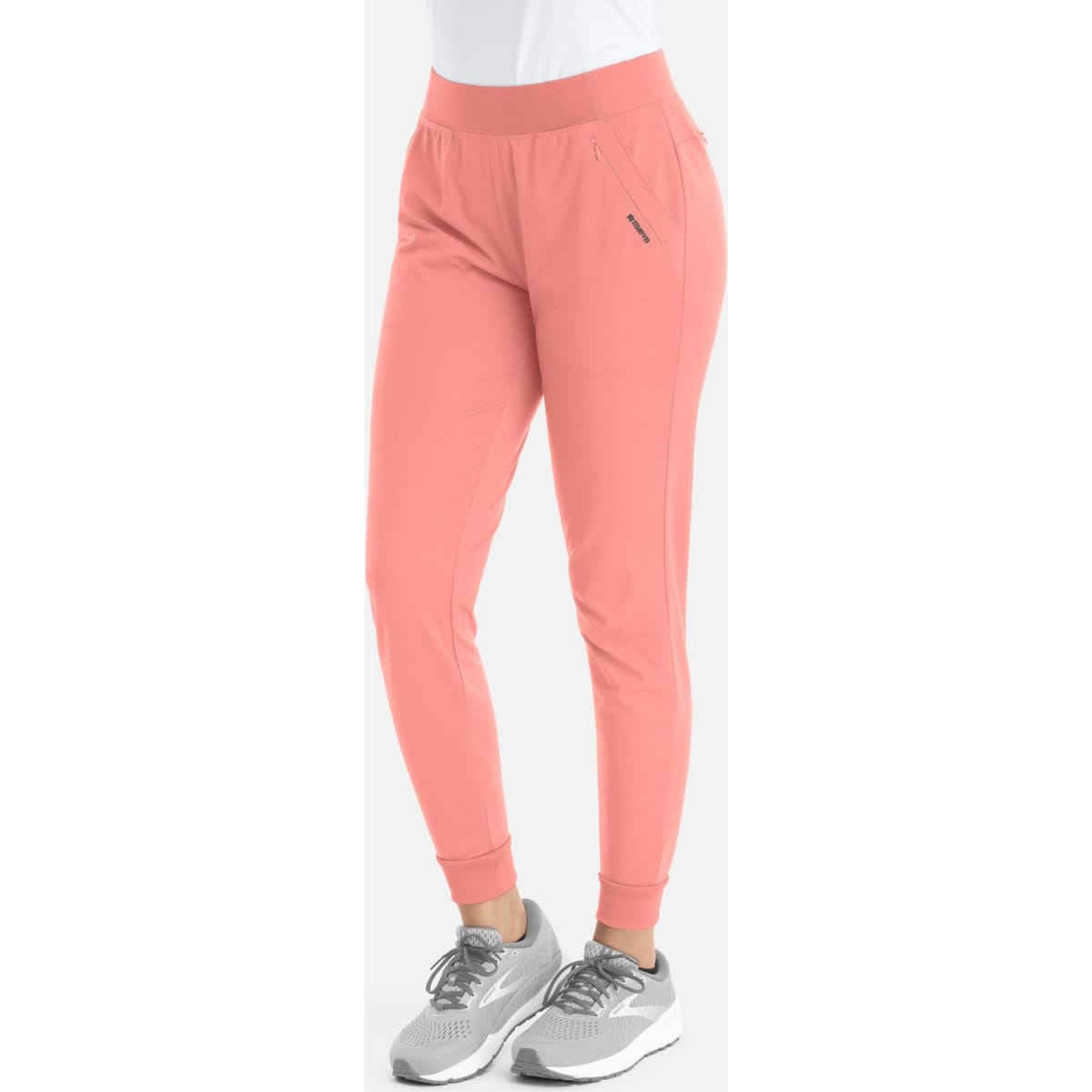 A pair of women's mid-rise joggers in a soft coral colour, featuring elastic waistband and cuffed ankles.