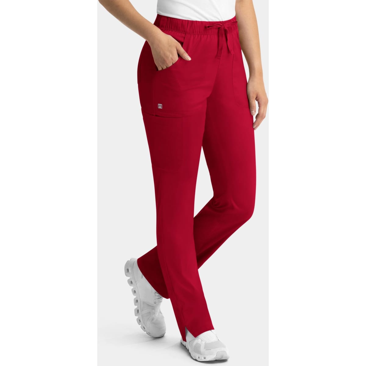 A pair of red women's cargo pants with a full elastic waistband and side pockets, featuring a branding logo.