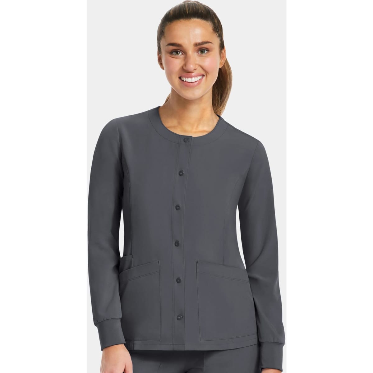 A women's round neck snap jacket in dark grey with long sleeves and two front pockets, featuring a logo.