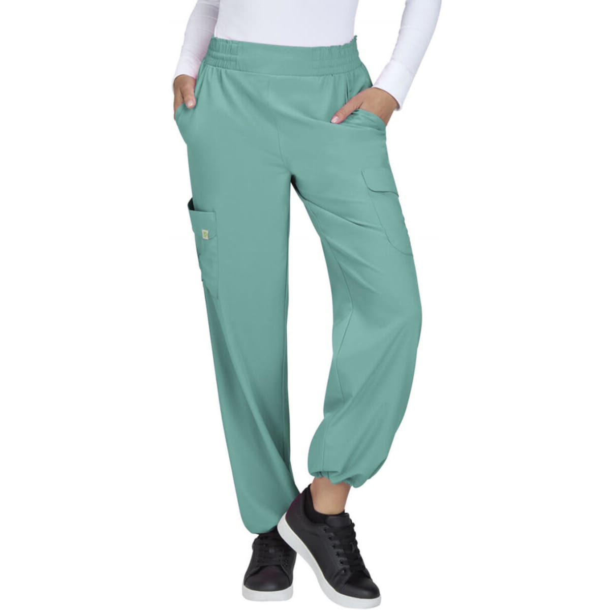 Ayla Pant in a light teal colour, featuring a relaxed fit, elastic waistband, and pockets on the sides.