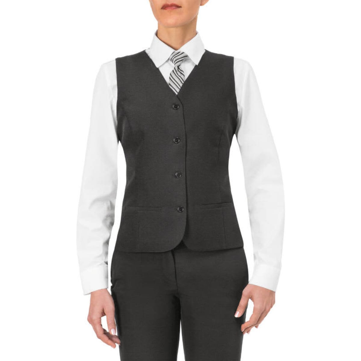 A woman wearing a grey Petra Vest over a white shirt, paired with a striped tie and black pants. The vest features buttons and a tailored fit.