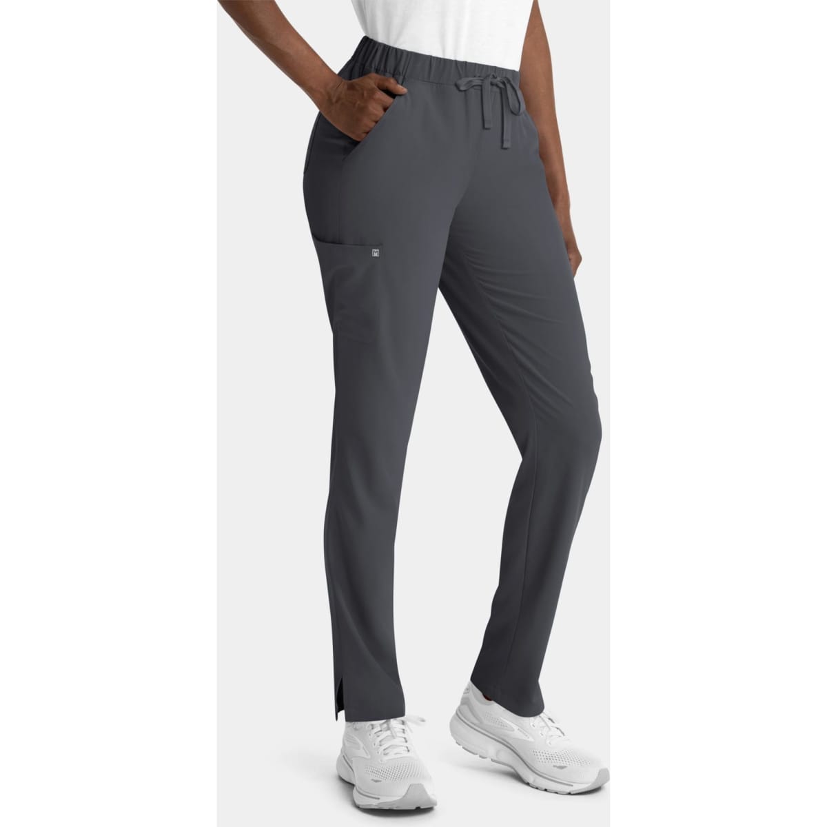 Grey women's skinny pull-on pants with pockets and a drawstring waist. Features branding on the garment.