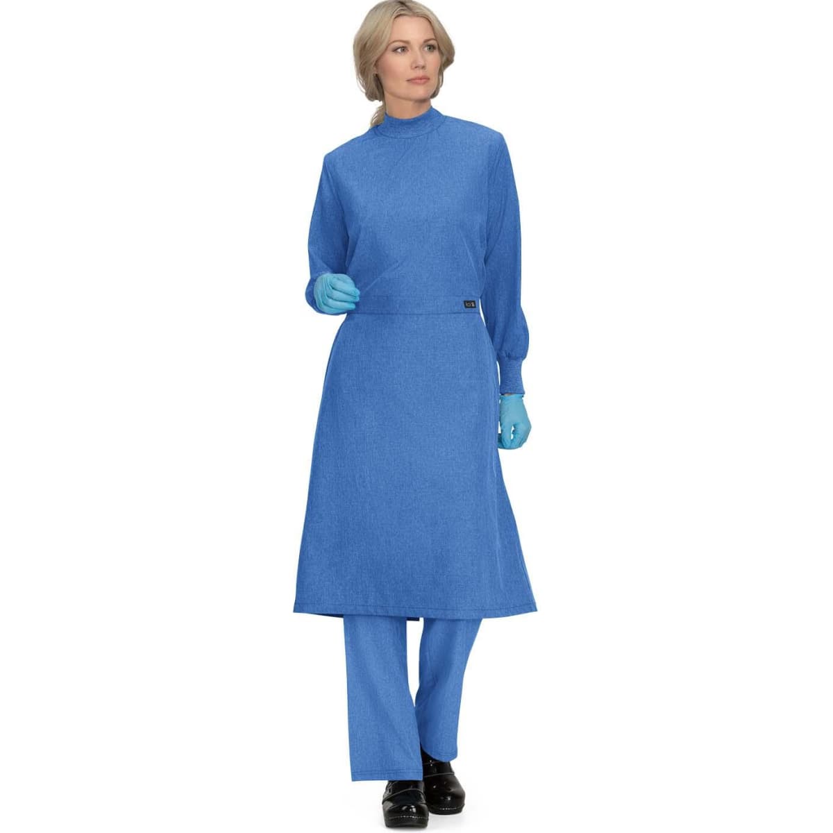 A blue clinical cover gown with long sleeves and an apron-style front, worn by a model.
