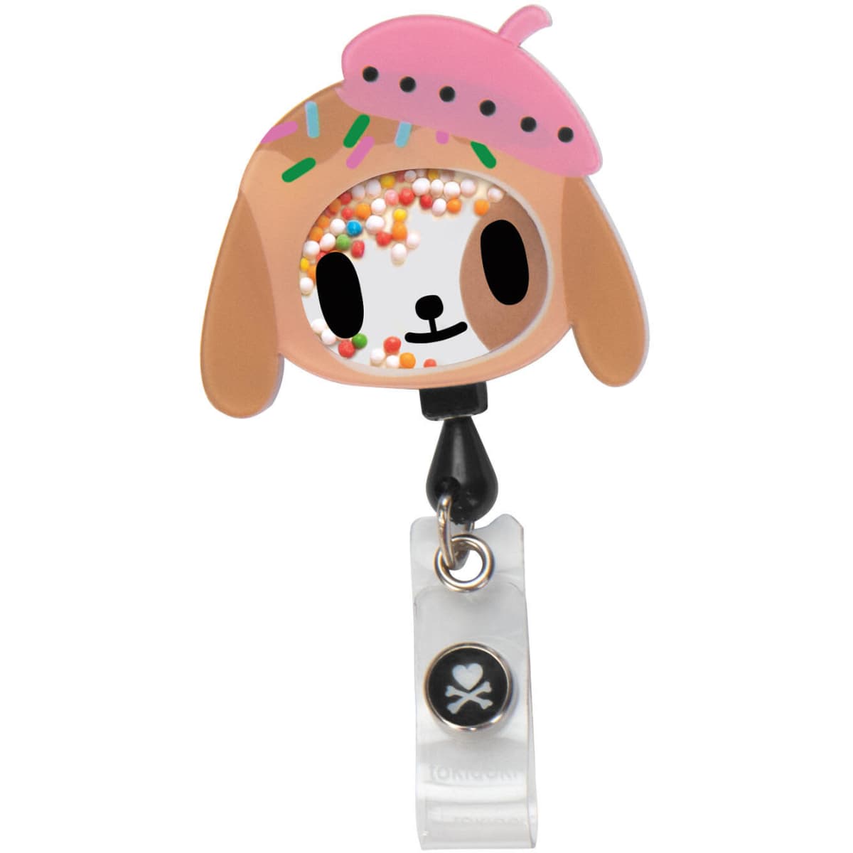 A colourful tokidoki Shaker Badge featuring a dog character with sprinkles and a pink hat, attached to a clear clip.