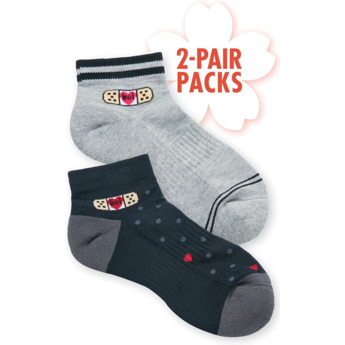 A pair of compression ankle socks, one in grey and the other in navy with polka dots, featuring a logo.
