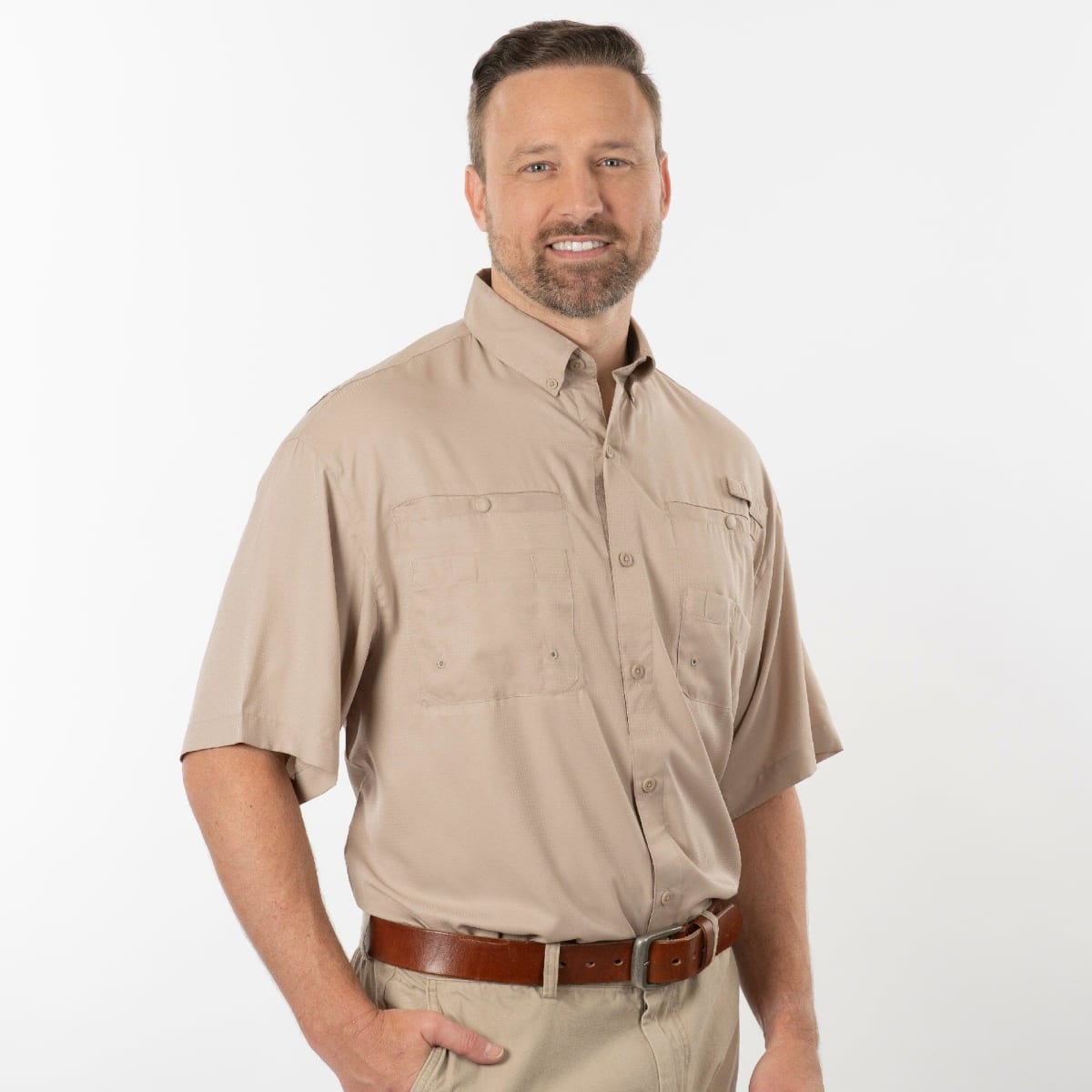 A short-sleeved black fishing shirt with a button-up front and two chest pockets, featuring a branding logo.
