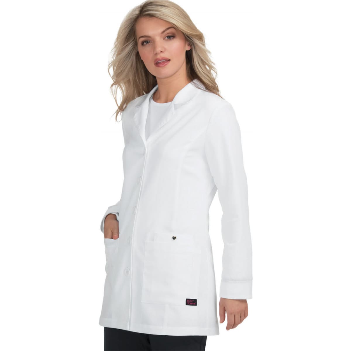 A white lab coat with a stylish design, featuring pockets and a logo, modeled by a woman.