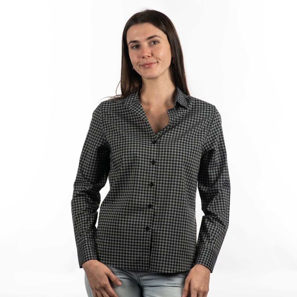 A woman wearing a black and white checked Stretched Poplin Shirt, featuring a button-up design and a collar.