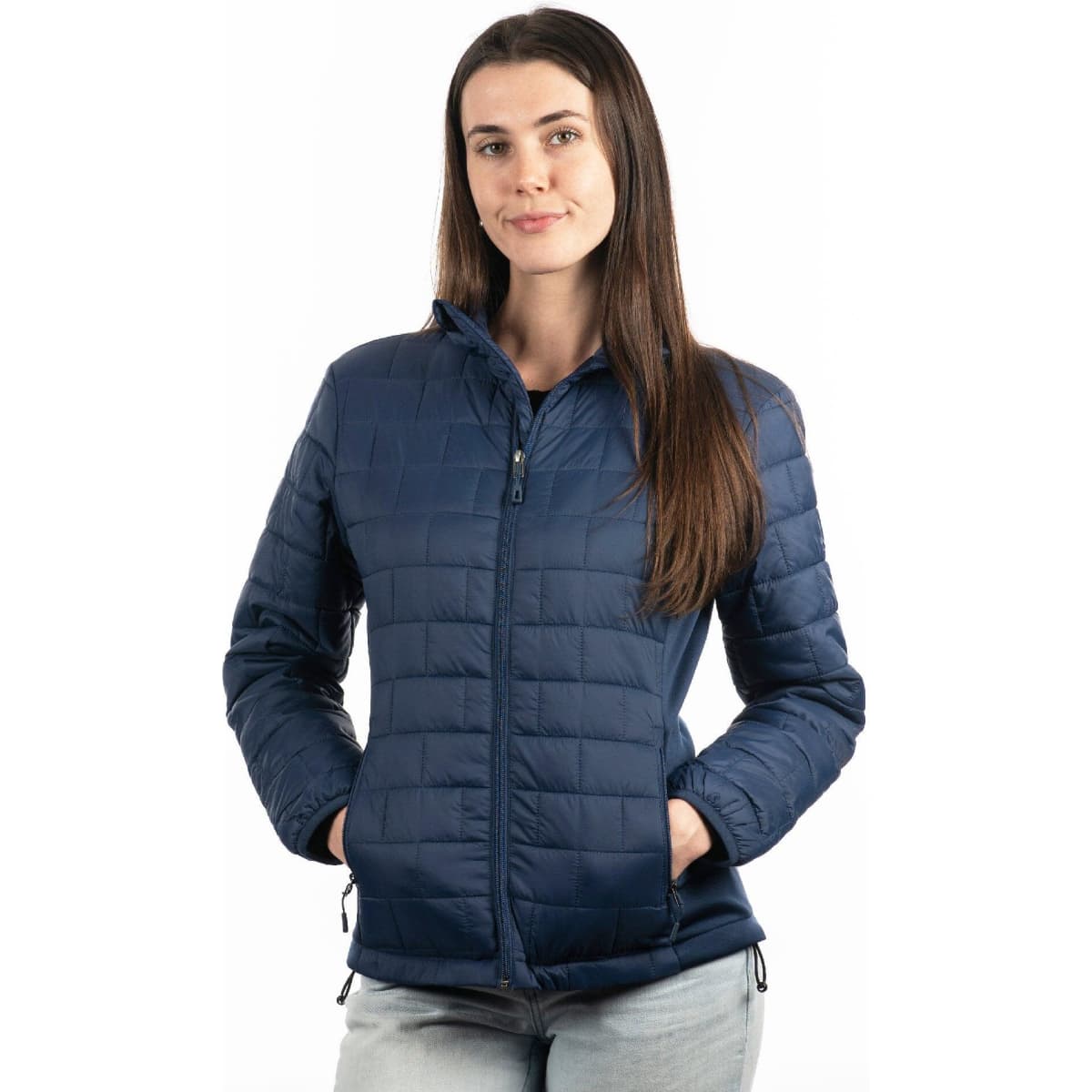 A woman wearing a navy quilted puffer jacket with a zip front and side pockets, featuring a logo.