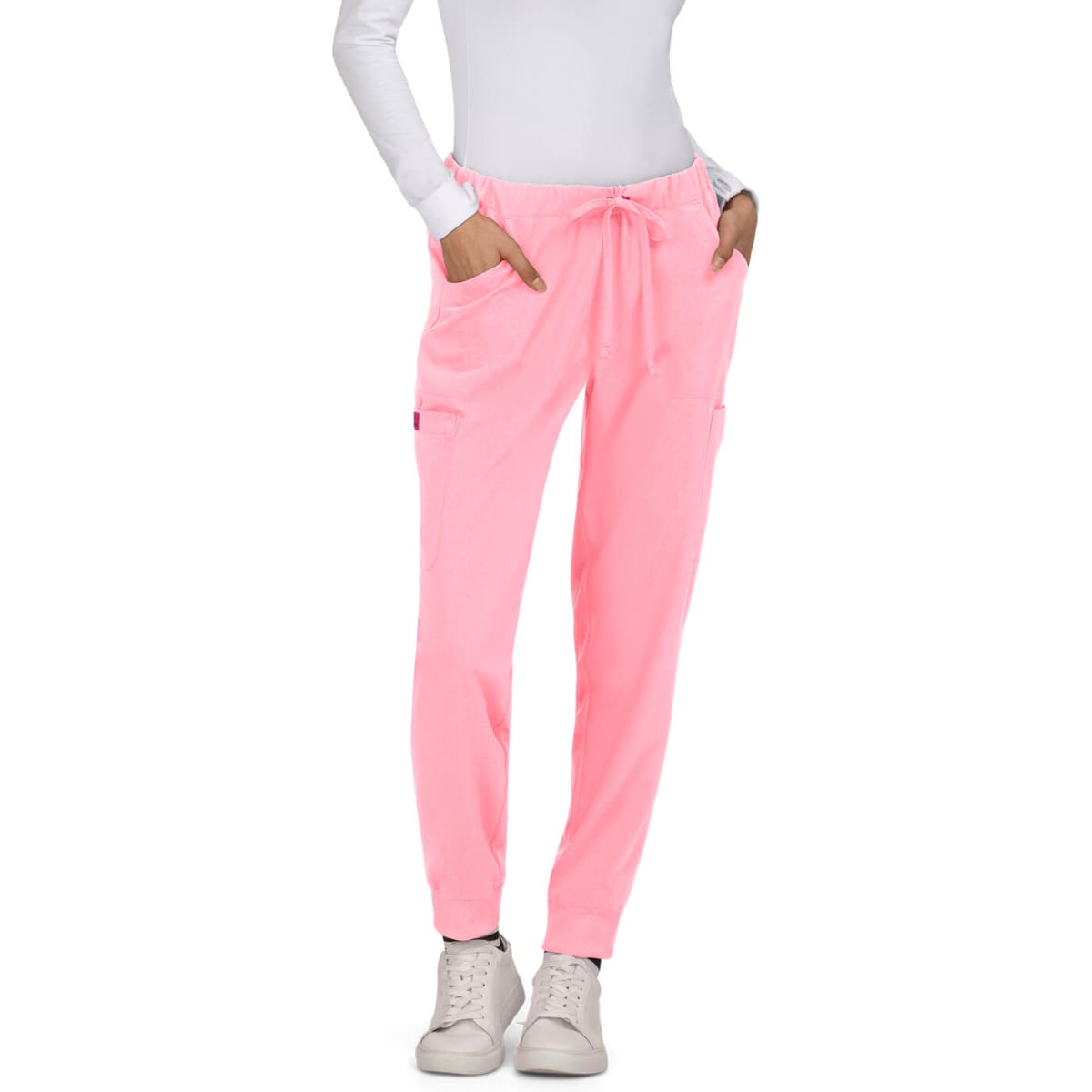 A pair of pink Aster Pants featuring elastic cuffs, drawstring waist, and side pockets.