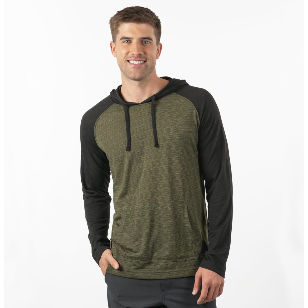 A yarn-dyed long sleeve knit hoodie in green with black sleeves. The model is smiling and wearing the hoodie.