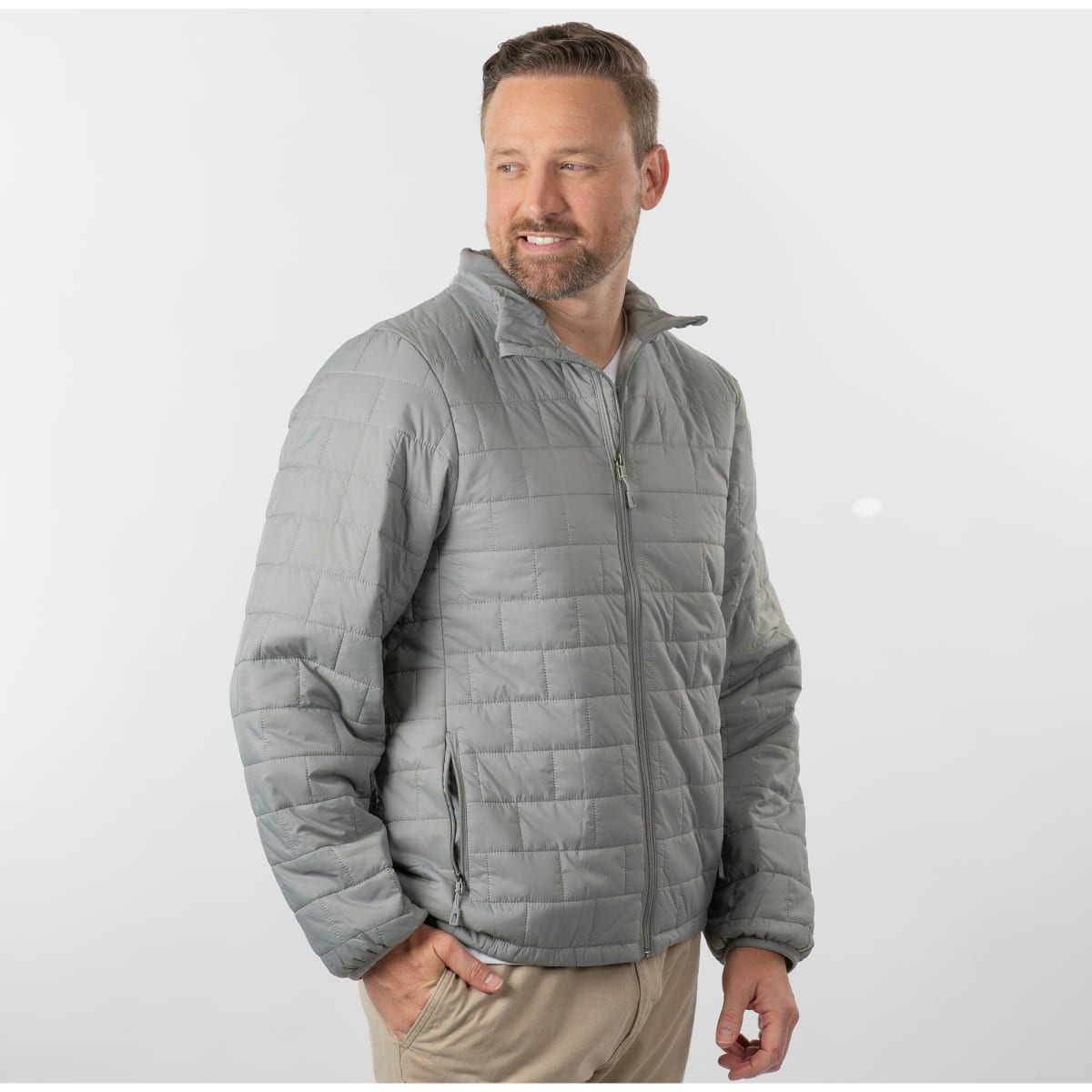 A grey quilted puffer jacket with a zip front and side pockets, worn by a model against a neutral background.