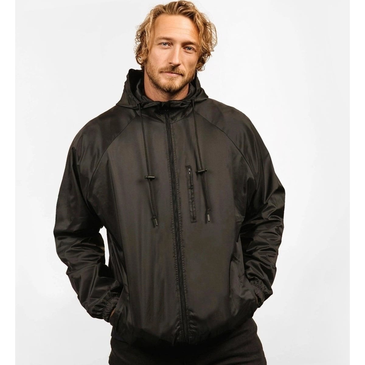 A black nylon jacket with a hood and adjustable drawstrings features a sleek, lightweight design. It has a logo.