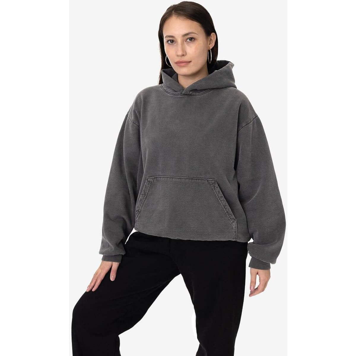 A heavy fleece hooded pullover in a grey colour, featuring a front pocket and relaxed fit. It has a logo present.