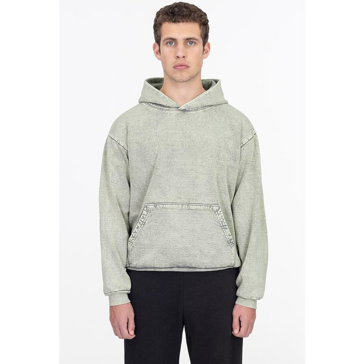 A heavy fleece hooded pullover in a mineral wash finish, featuring a front pocket and a logo. The colour is muted green.