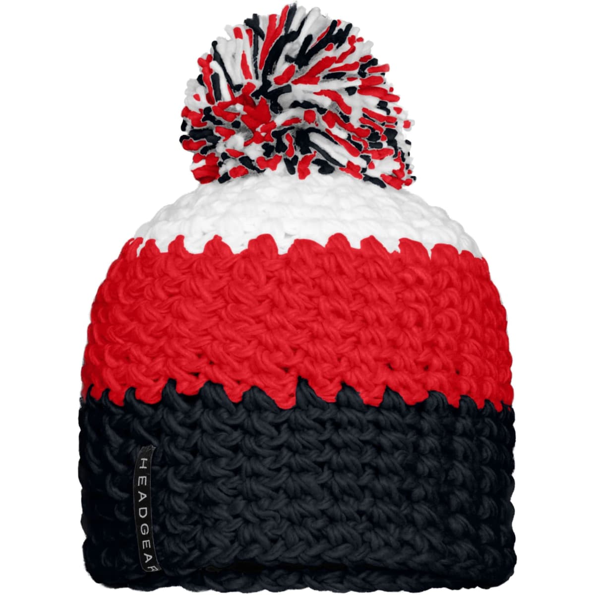 A knitted beanie in red, white and navy blue, featuring a large pompon on top and a logo on the side.